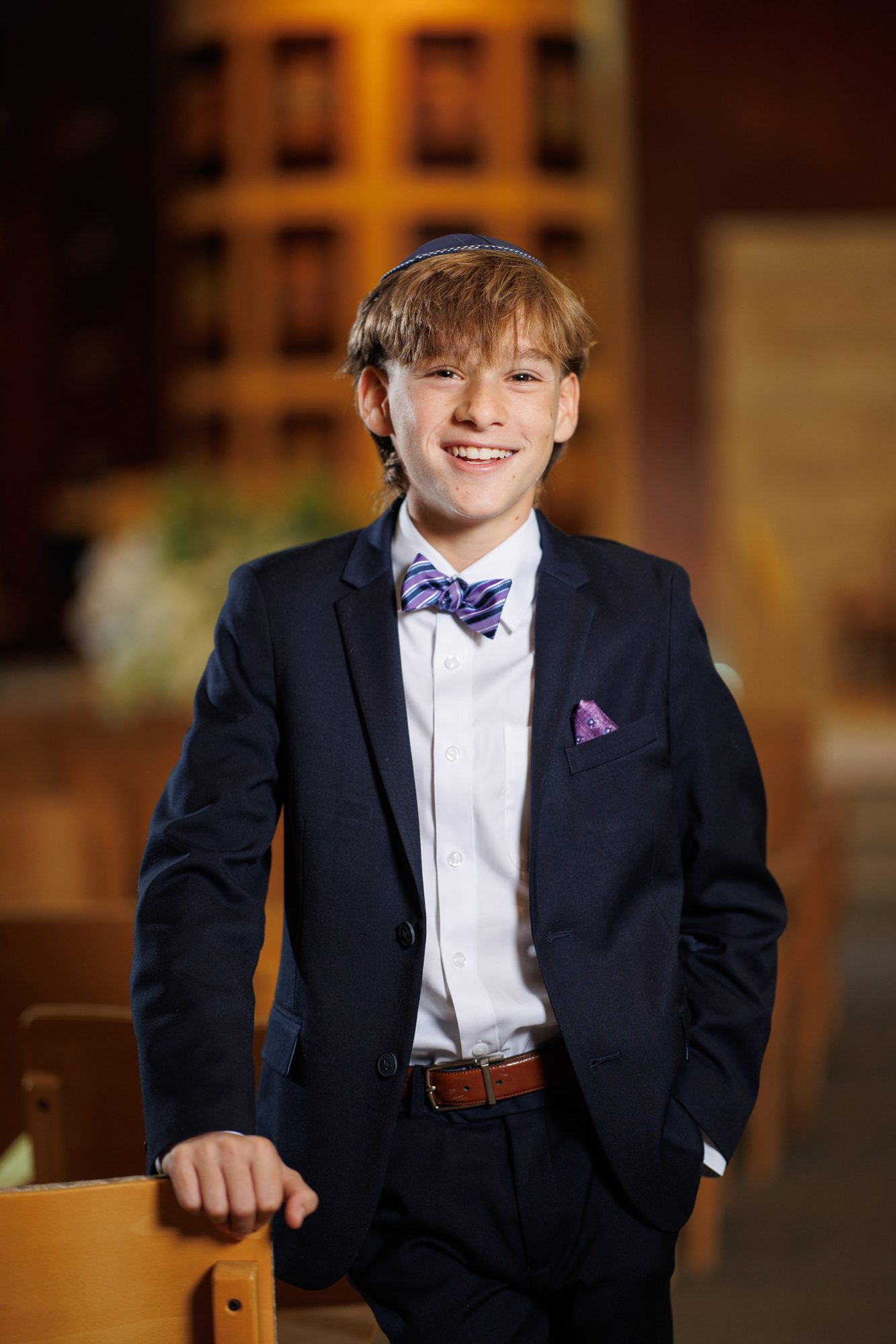 Bar mitzvah boy portrait in synagogue by Alison Tremblay